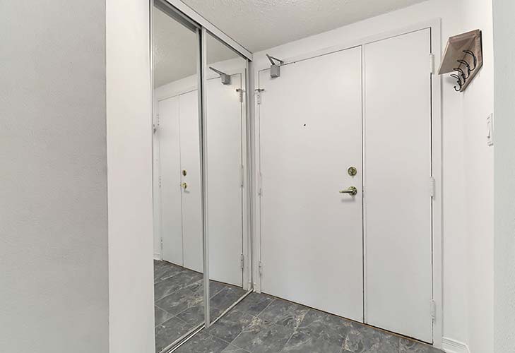008-Foyer With Mirrored Sliding Panel Closet